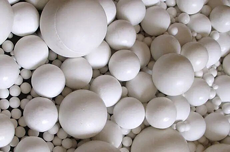inert ceramic ball for olefin purification systems